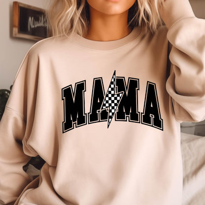 May include: A light beige sweatshirt with a black graphic print of the word "MAMA" with a checkered lightning bolt in the center.