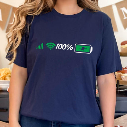 May include: A navy blue t-shirt with a white graphic of a signal bar, wifi symbol, the number 100%, and a green battery icon with a lightning bolt inside. The battery is fully charged.