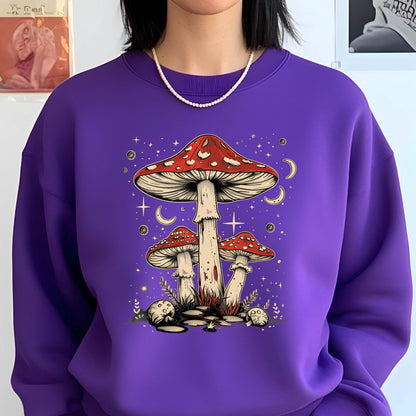 May include: Purple sweatshirt with a graphic of three red and white mushrooms with white stems against a dark purple background with white stars and crescent moons.