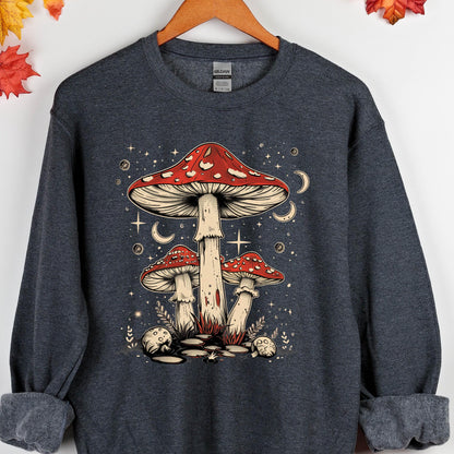 May include: A dark gray sweatshirt with a graphic of three red and white mushrooms with white spots. The mushrooms are surrounded by white stars and crescent moons. 