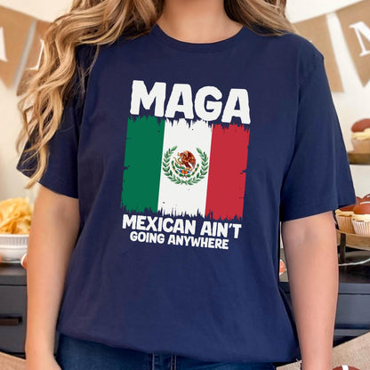 May include: A navy blue t-shirt with a white graphic of the Mexican flag and the text "Maga Mexican Ain't Going Anywhere".