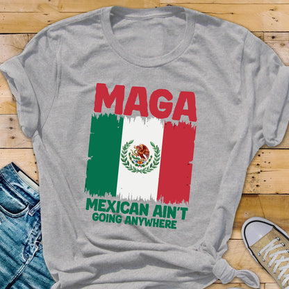 May include: Gray t-shirt with the text "Maga Mexican Ain't Going Anywhere" and a distressed image of the Mexican flag.