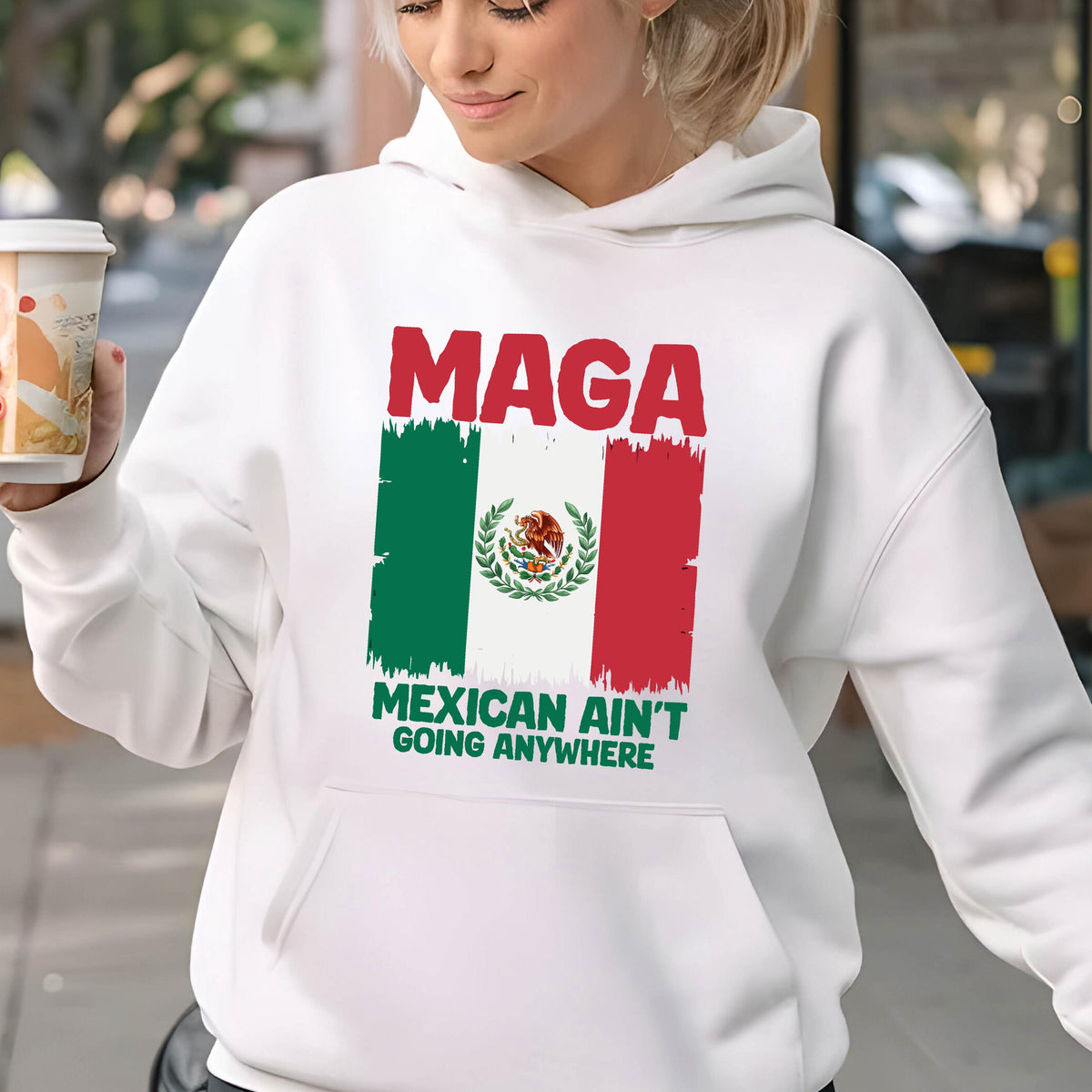 May include: White hoodie with a red, white, and green Mexican flag and the text "Maga Mexican Ain't Going Anywhere".