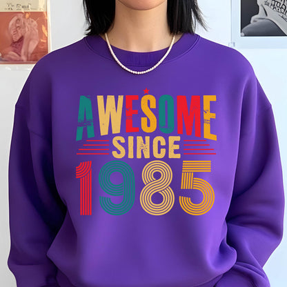May include: Purple sweatshirt with the text "AWESOME SINCE 1985" in a retro rainbow design.