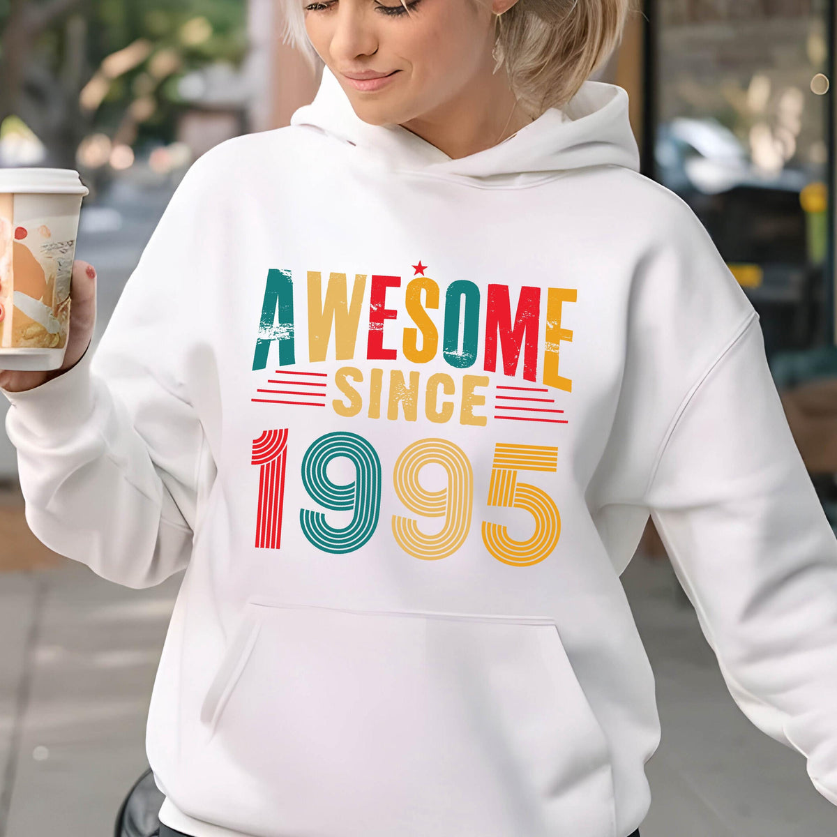 May include: White hoodie with a vintage-style graphic that says "Awesome Since 1995" in red, yellow, green, and blue.