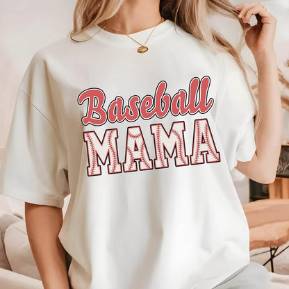 May include: White t-shirt with a red and white baseball graphic and the text "Baseball Mama".