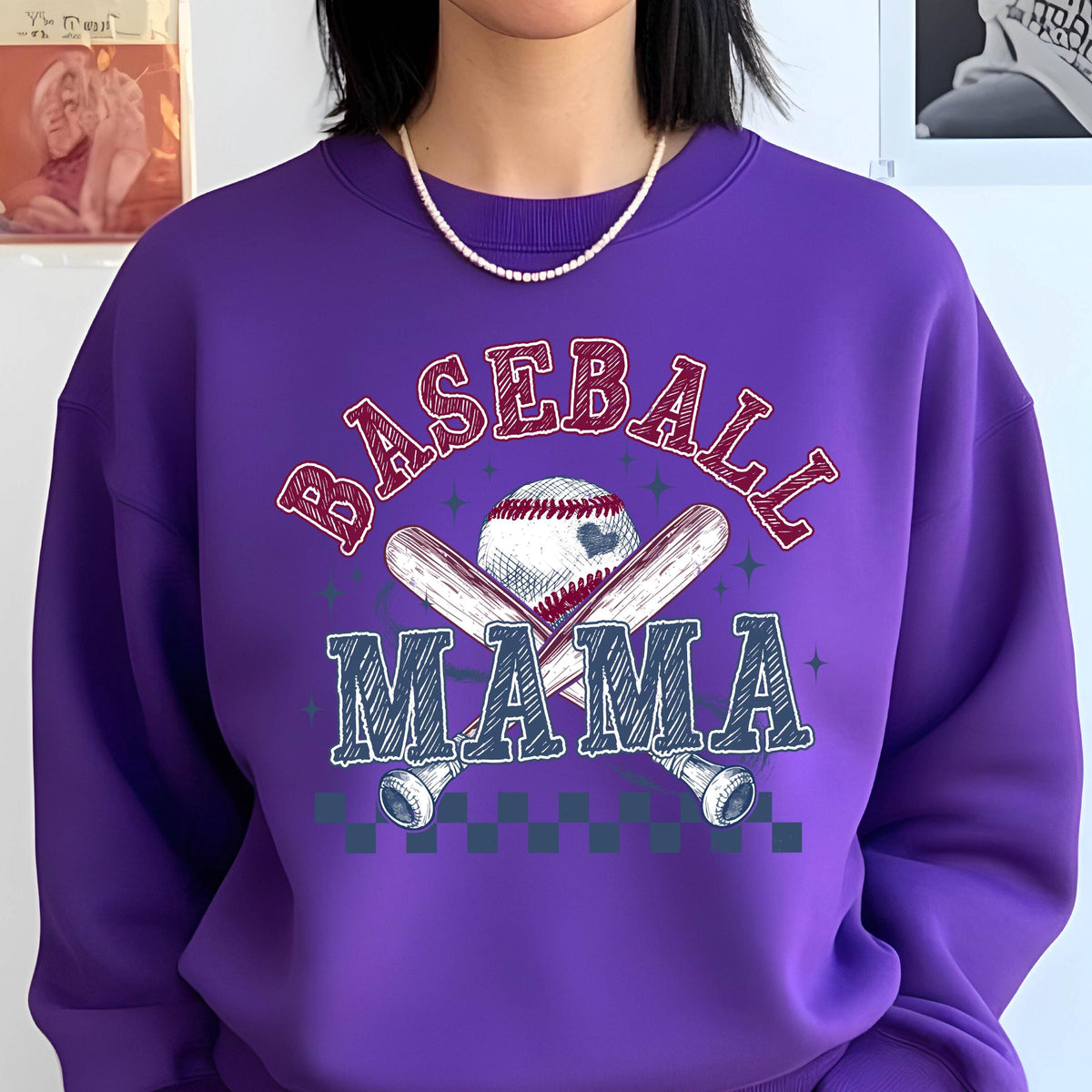 May include: Purple sweatshirt with a baseball graphic and the text "Baseball Mama".
