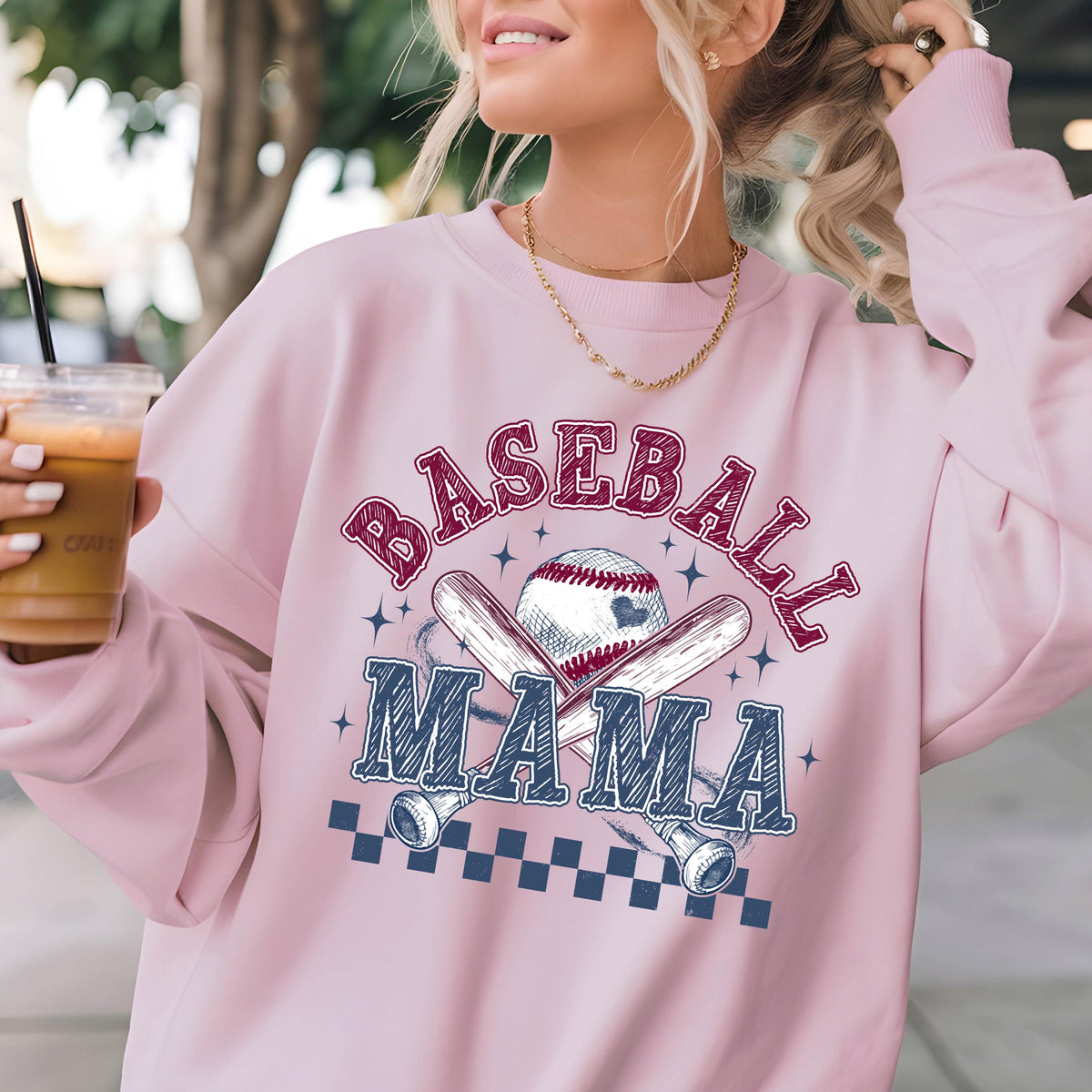 May include: Pink sweatshirt with a baseball graphic and the text "Baseball Mama" in a red and blue color scheme.