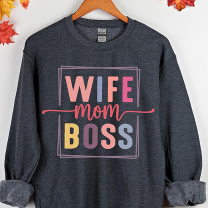 May include: A dark gray sweatshirt with the text "Wife Mom Boss" in a colorful rectangular box. The text is in a rainbow color scheme.