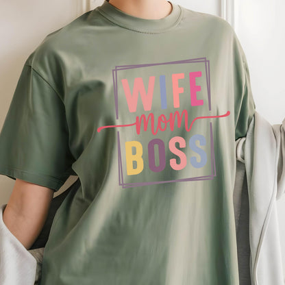 May include: Green t-shirt with a colorful graphic that says "Wife Mom Boss" in a box.