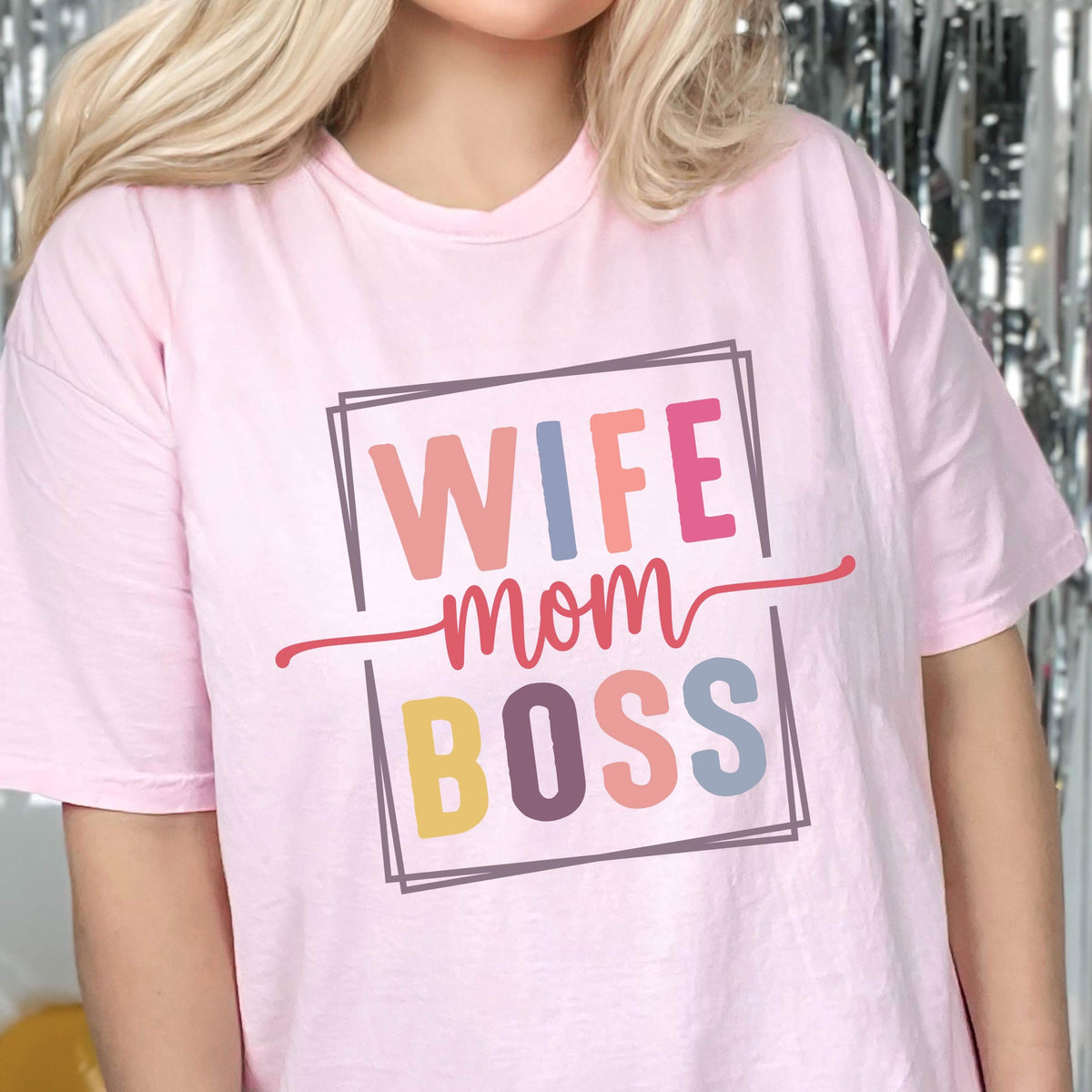 May include: Pink t-shirt with the text "Wife Mom Boss" in a colorful box.