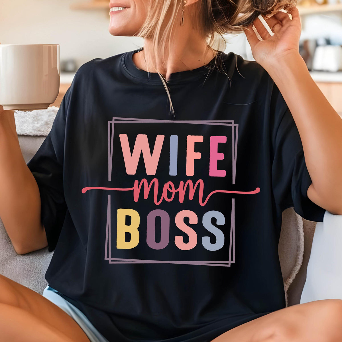 May include: Black t-shirt with a colorful graphic that says "Wife Mom Boss" in a square frame.