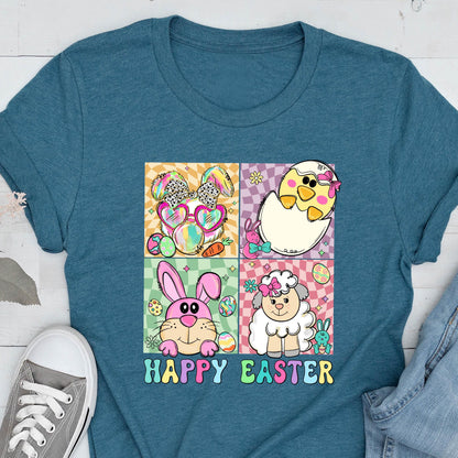 May include: Teal t-shirt featuring a colorful graphic with Easter-themed illustrations. The design includes a bunny with heart-shaped sunglasses, a chick hatching from an egg, a pink bunny, and a sheep. The words "HAPPY EASTER" are printed below the images.