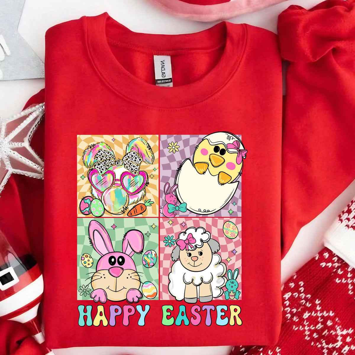 May include: Red sweatshirt with a graphic of a bunny, chick, and lamb with Easter eggs and the text "Happy Easter".