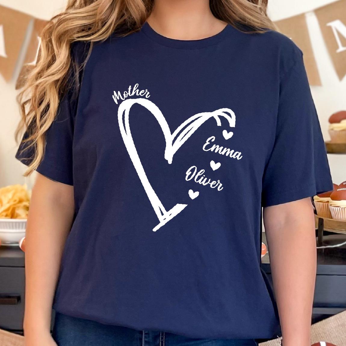 May include: Navy blue t-shirt with a white heart design and the words "Mother", "Emma", and "Oliver" inside the heart.