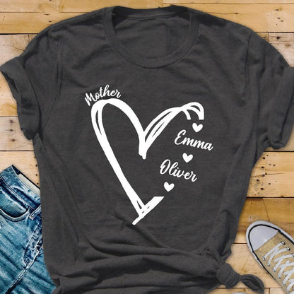May include: Gray t-shirt with a white heart design and the words "Mother", "Emma", and "Oliver" inside the heart.