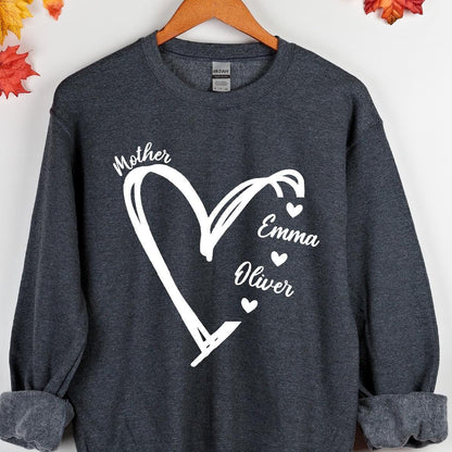 May include: A dark gray sweatshirt with a white heart design. The heart has the word "Mother" at the top and the names "Emma" and "Oliver" inside the heart.