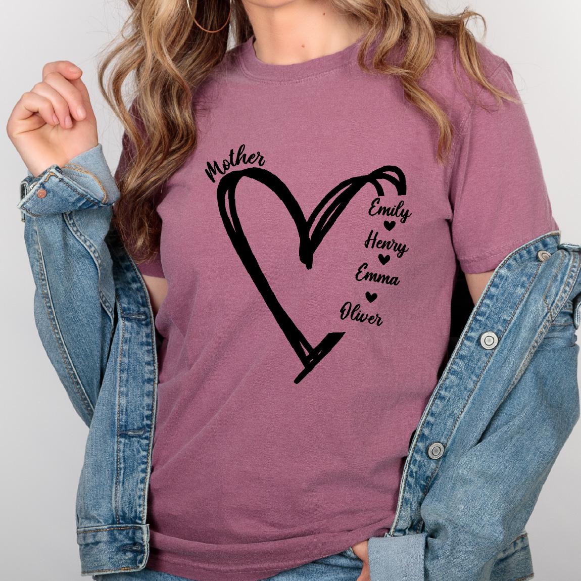 May include: A mauve short-sleeved t-shirt featuring a black graphic of a hand-drawn heart outline. The text Mother is printed above the heart, while the names Emily, Henry, Emma, and Oliver are listed vertically inside the heart with small hearts.