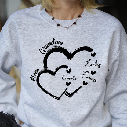 May include: Gray sweatshirt with a black design of two overlapping hearts. The text "Mom", "Grandma", "Charlotte", "Emily", and "Emma" are written inside the hearts.