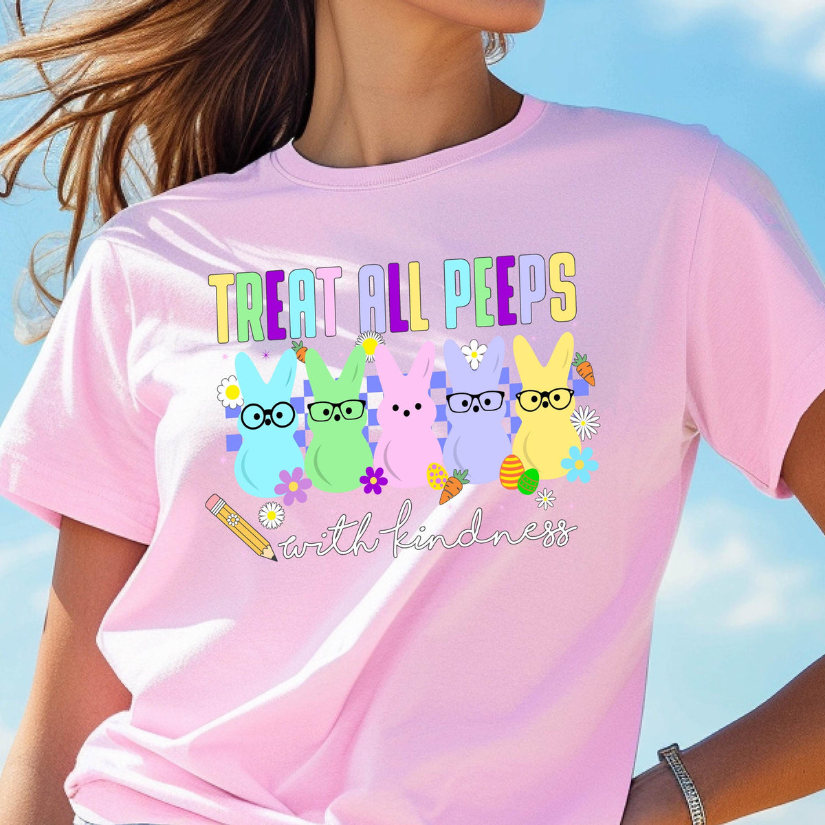 May include: Pink t-shirt with a graphic of five pastel-colored Peeps with glasses and the text "Treat all peeps with kindness" and a pencil.