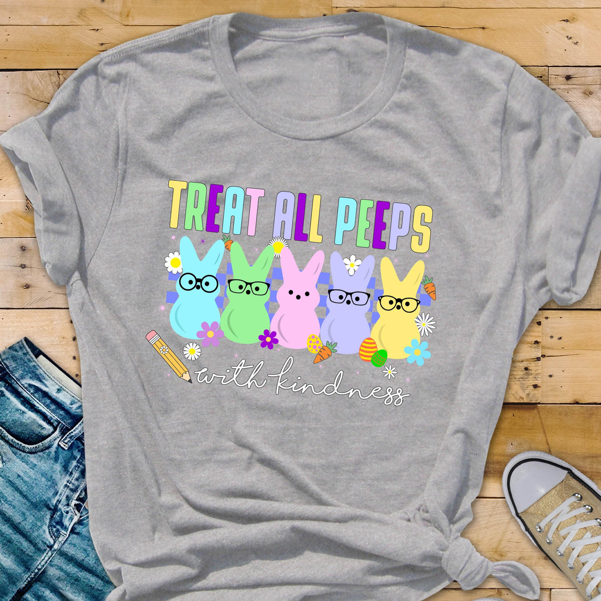 May include: A gray t-shirt with a graphic of five pastel-colored peeps wearing glasses and the text "Treat all peeps with kindness".