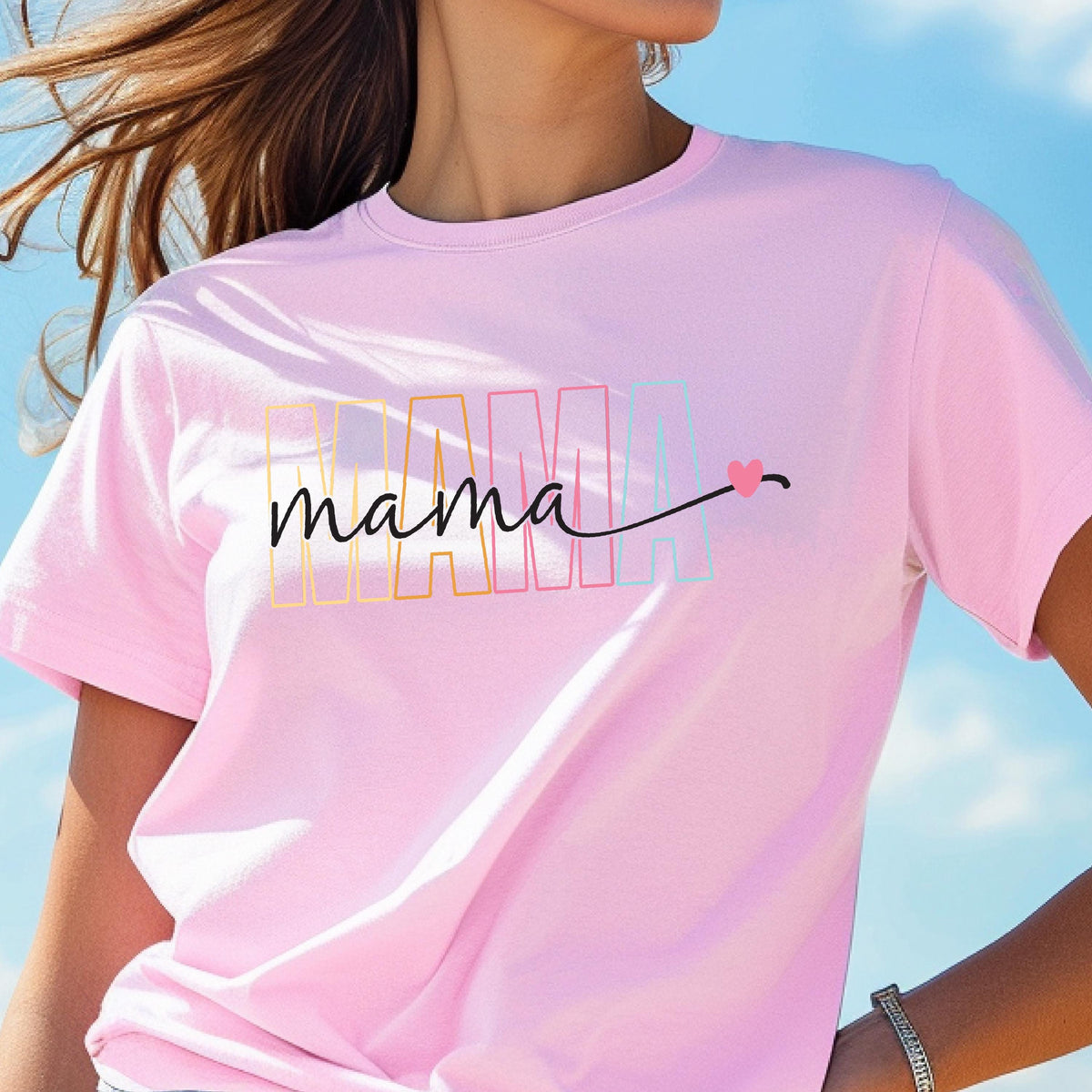 May include: Pink t-shirt with the word "mama" in rainbow colors and a small pink heart.