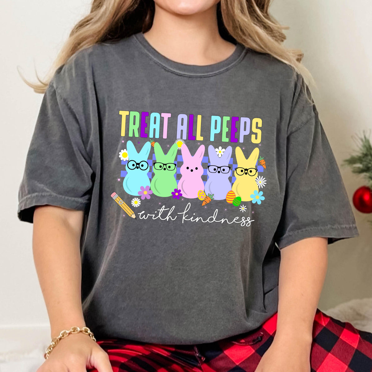 May include: A gray t-shirt with a graphic of five colorful Peeps with glasses and the text "Treat all peeps with kindness".