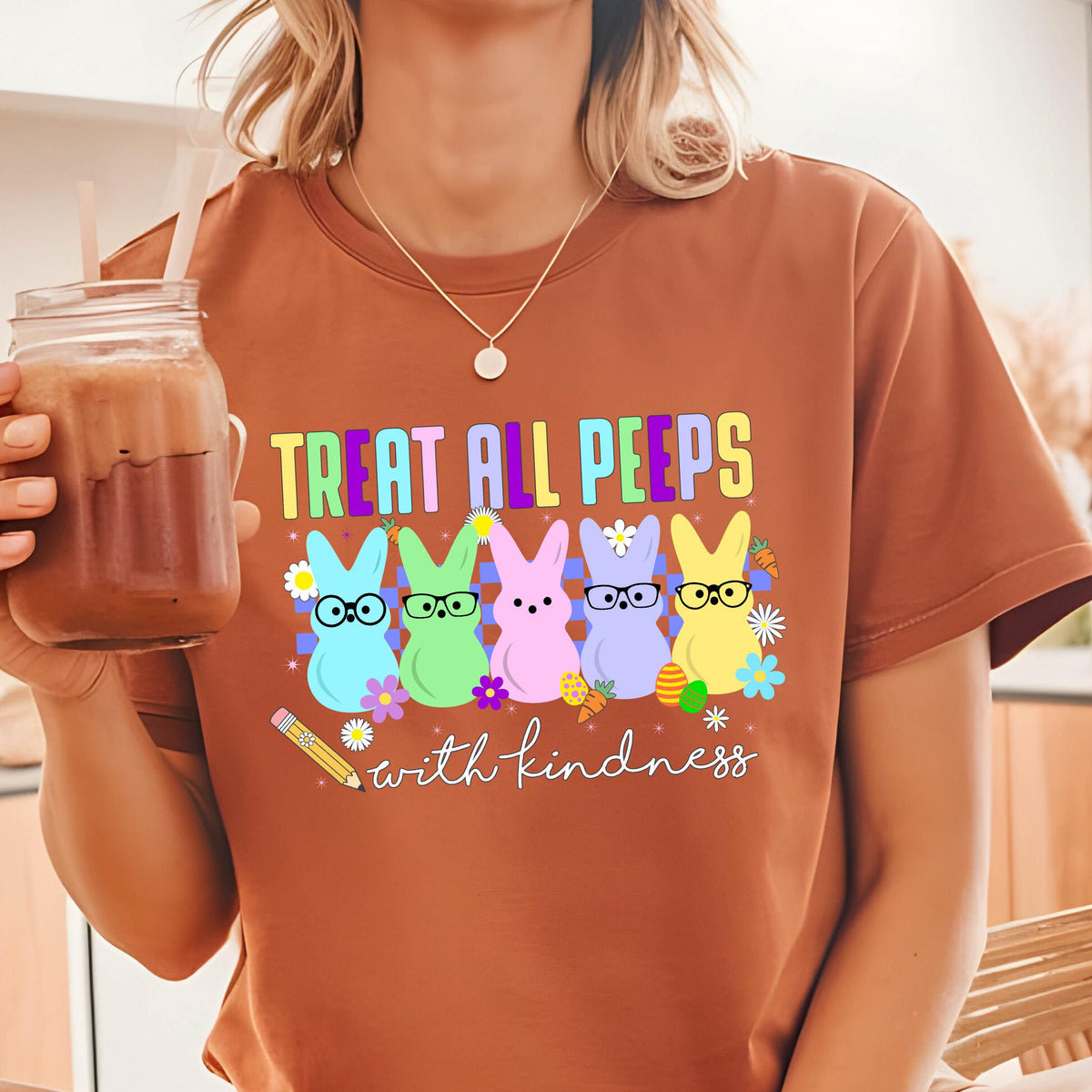 May include: Brown t-shirt with a graphic of five cartoon peeps wearing glasses and the text "Treat all peeps with kindness".
