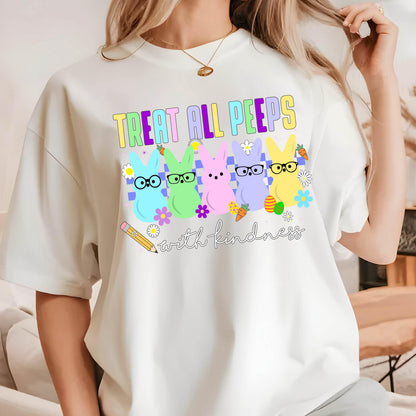 May include: White t-shirt with a graphic of pastel-colored Peeps with glasses and the text "Treat all peeps with kindness".