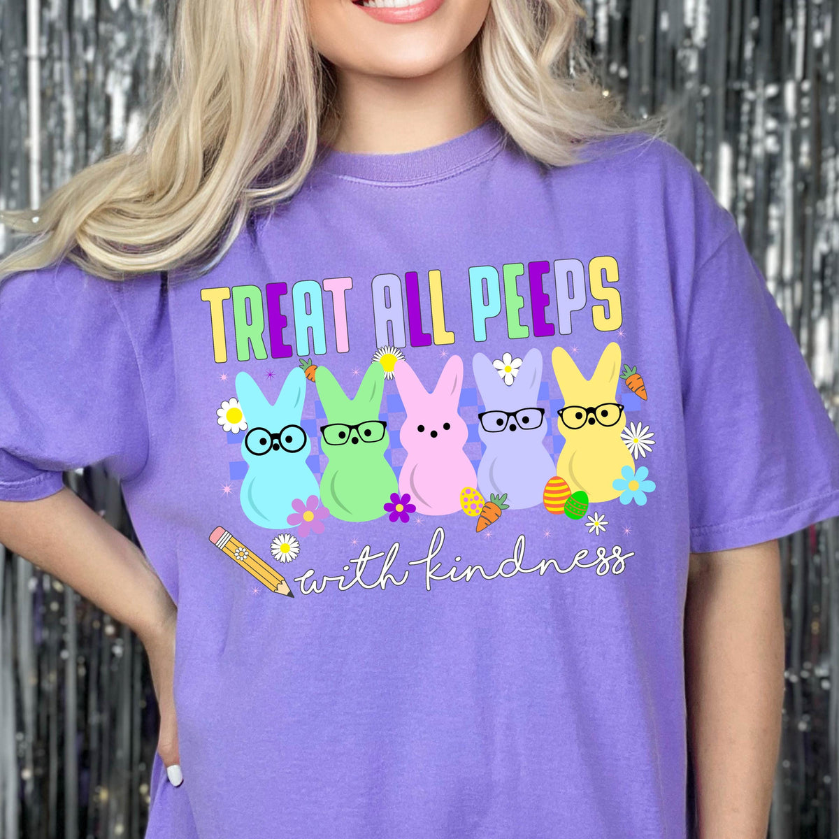 May include: Purple t-shirt with the text "Treat all peeps with kindness" and a row of five cartoon peeps wearing glasses. The peeps are yellow, pink, green, blue, and light blue.