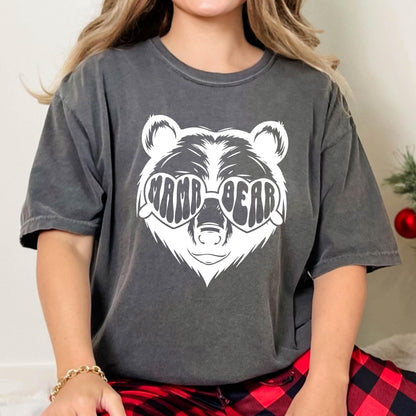 May include: A gray t-shirt with a white bear wearing heart-shaped sunglasses that say "Mama Bear".