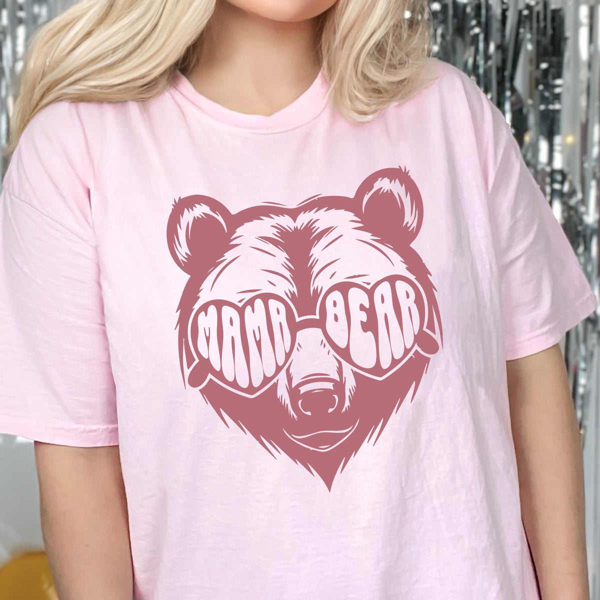 May include: Pink t-shirt with a pink bear wearing heart-shaped sunglasses that say "Mama Bear".