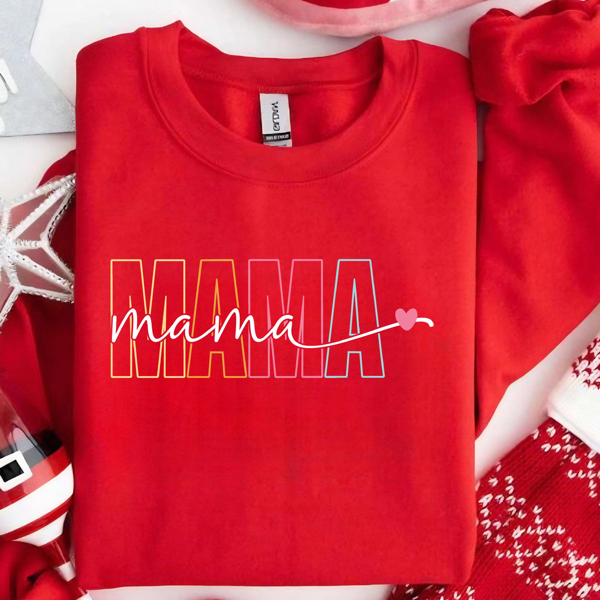 May include: Red sweatshirt with the word "MAMA" in rainbow colors and a small pink heart.