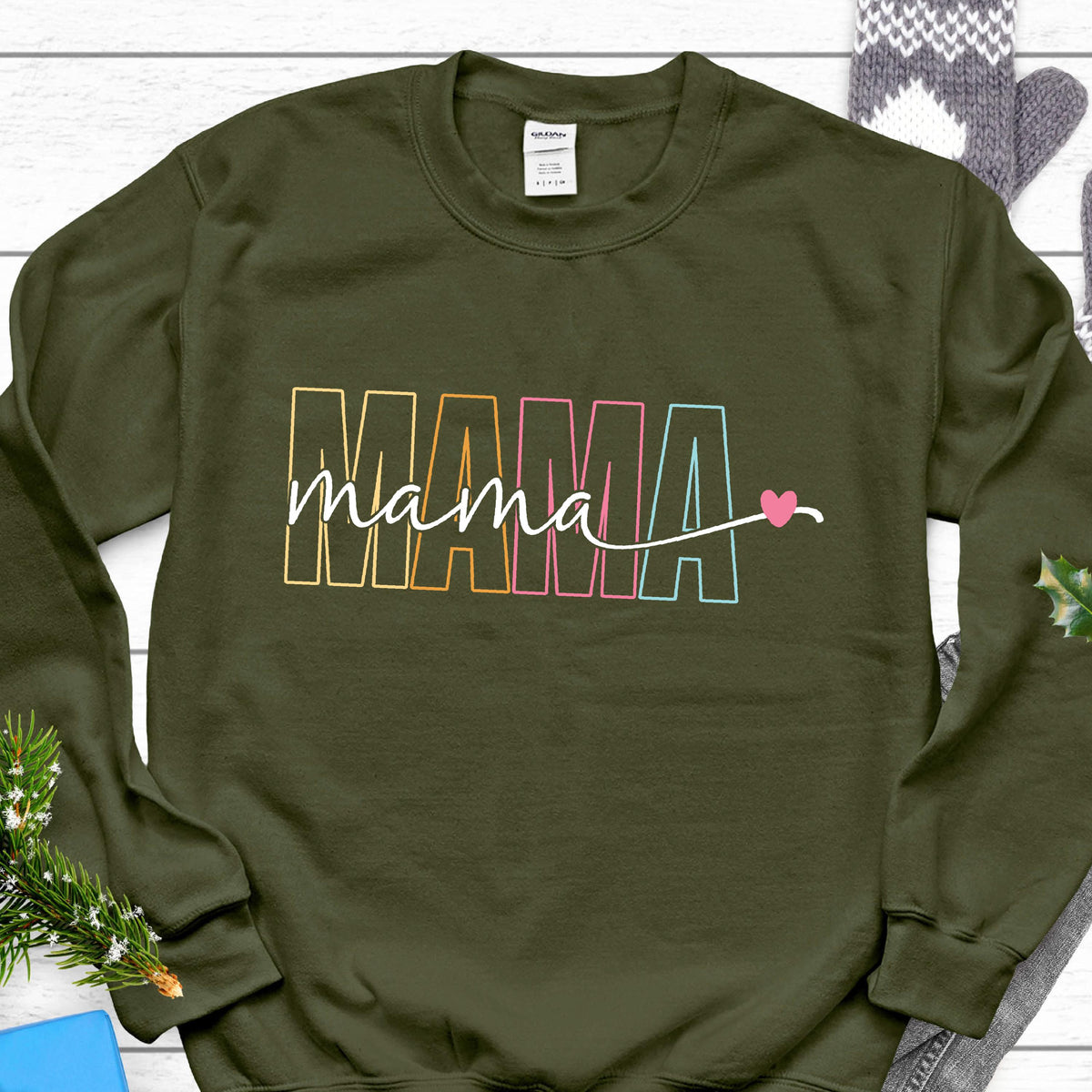 May include: A green sweatshirt with the word "MAMA" in rainbow colors and a small pink heart.