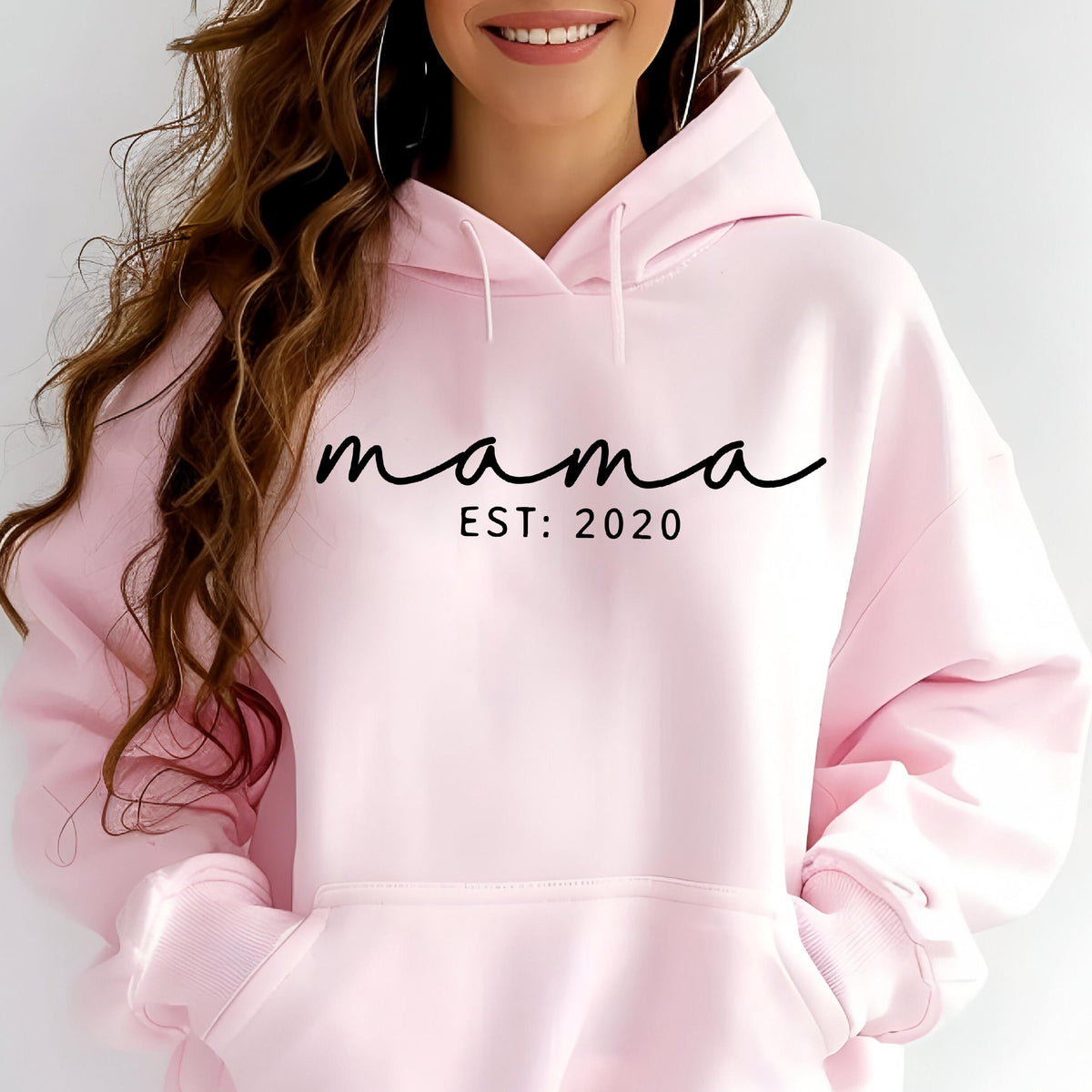 May include: Pink hooded sweatshirt with the text "mama est: 2020" in black.