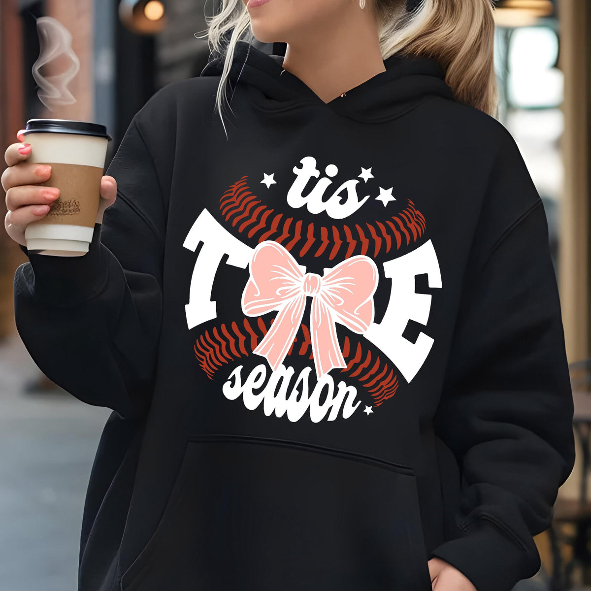 May include: Black hoodie with a white baseball graphic and the text "'tis the season" with a pink bow.