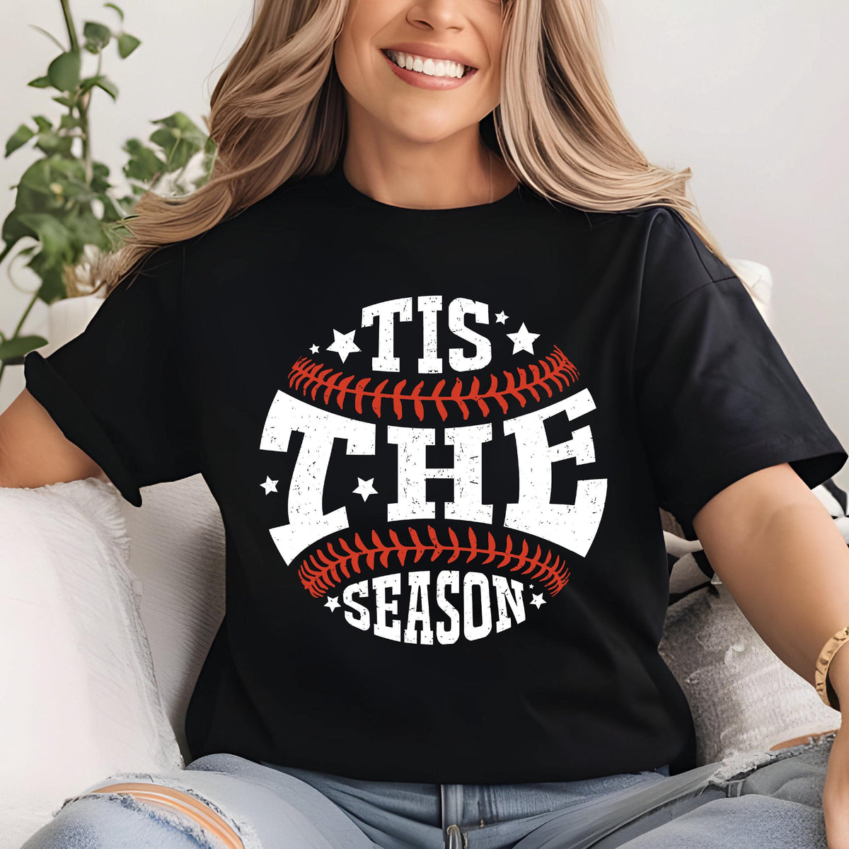 May include: Black t-shirt with a white baseball graphic and the text "Tis the Season" in white.