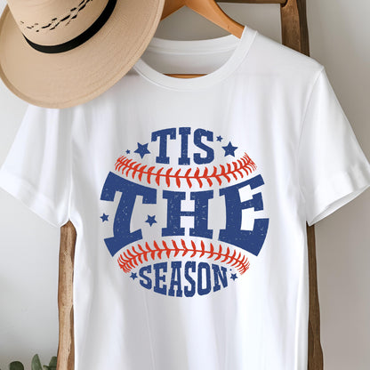 May include: White t-shirt with a blue and red baseball graphic that says "Tis the Season" with stars around the graphic.