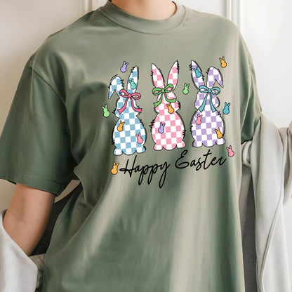 May include: A green t-shirt with a graphic of three checkered Easter bunnies and the text "Happy Easter".