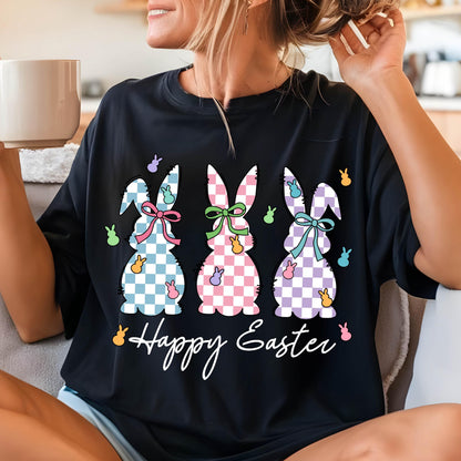 May include: Black t-shirt with a graphic of three checkered Easter bunnies and the text "Happy Easter".