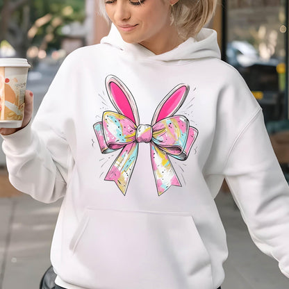 May include: White hoodie with a pink and white bow with bunny ears on the front.