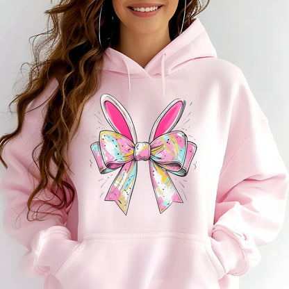 May include: Pink hoodie with a colorful bow and bunny ears graphic print.