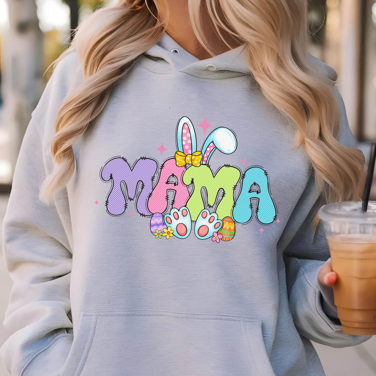 May include: A light gray hoodie with a colorful graphic of the word "MAMA" with bunny ears and Easter eggs. 