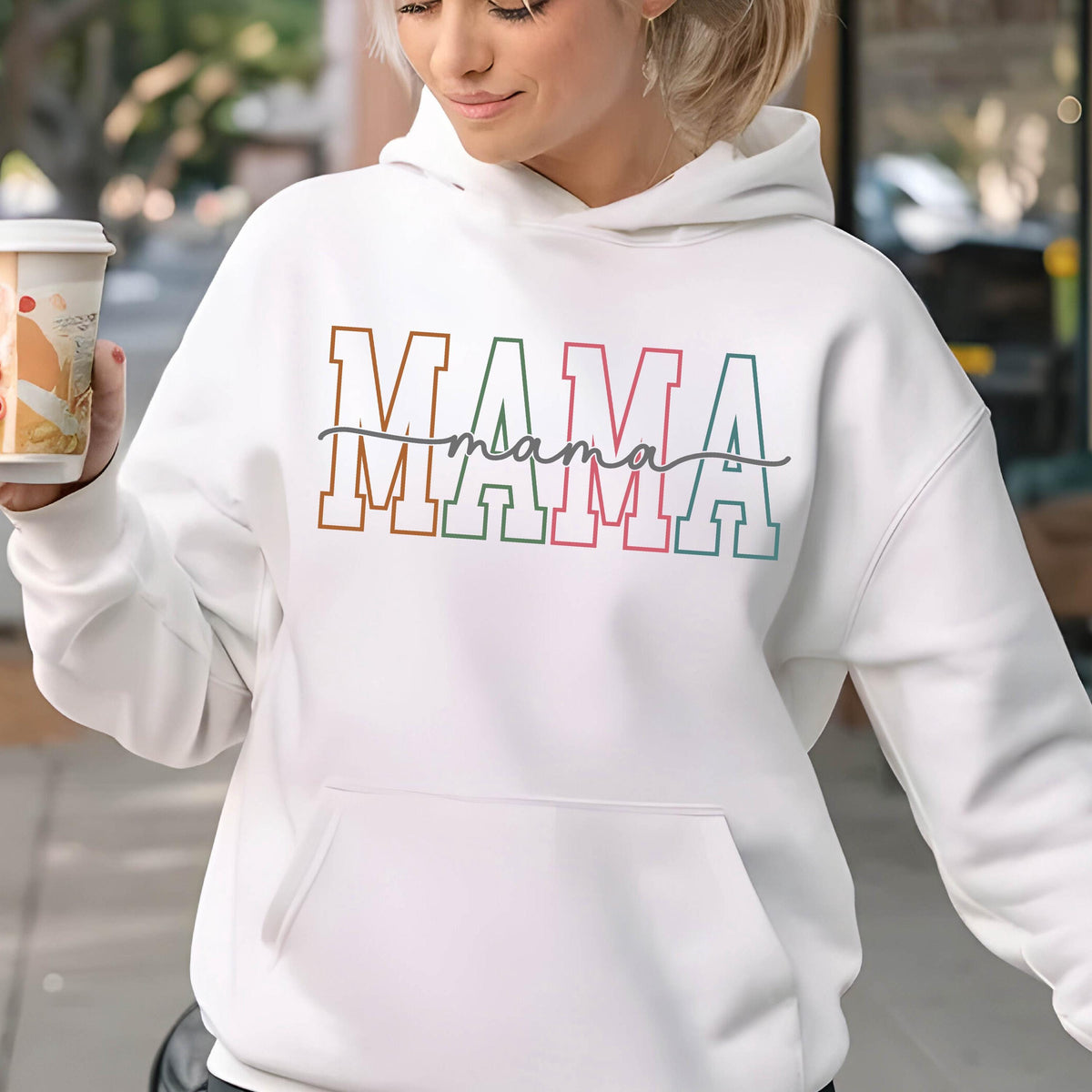 May include: White hooded sweatshirt with the word "MAMA" in colorful block letters and the word "mama" written in cursive underneath.