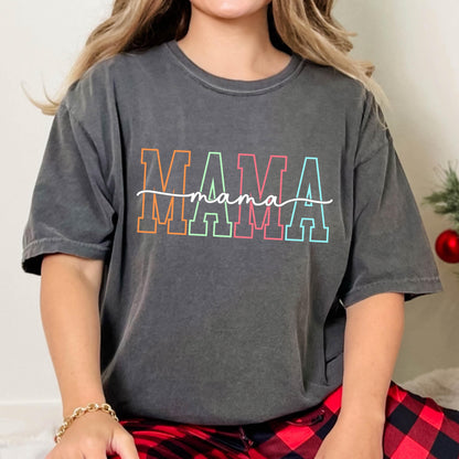 May include: A charcoal gray t-shirt with the word "MAMA" in rainbow colors and the word "mama" written in cursive underneath.