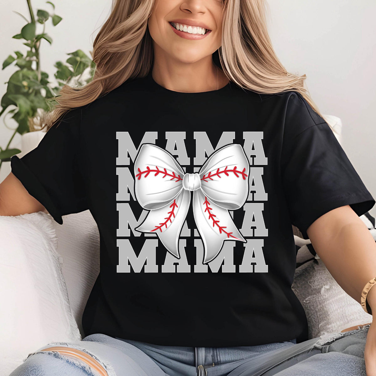May include: Black t-shirt with a white baseball-themed bow and the text "MAMA" repeated four times in gray.