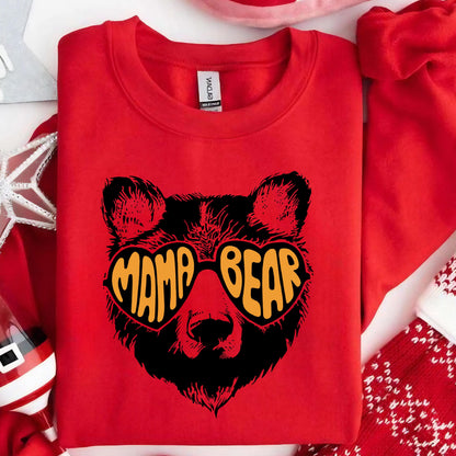 May include: Red sweatshirt with a black bear wearing heart-shaped sunglasses that say "Mama Bear" in orange letters.
