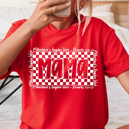 May include: Red t-shirt with a white checkered background and the word "Mama" in red letters. The text "Motherhood is Kingdom Work - Proverbs 3:25-27" is written on the top and bottom of the checkered background.
