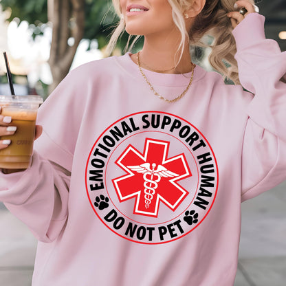 May include: Pink sweatshirt with a black and white graphic that says "Emotional Support Human Do Not Pet" with a red medical symbol in the center.