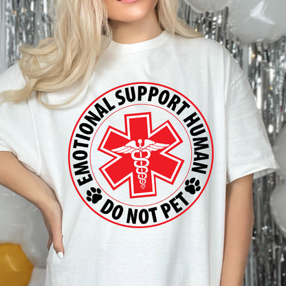 May include: White t-shirt with a black and red circle graphic that says "Emotional Support Human Do Not Pet". The graphic features a red medical symbol with a snake and wings.